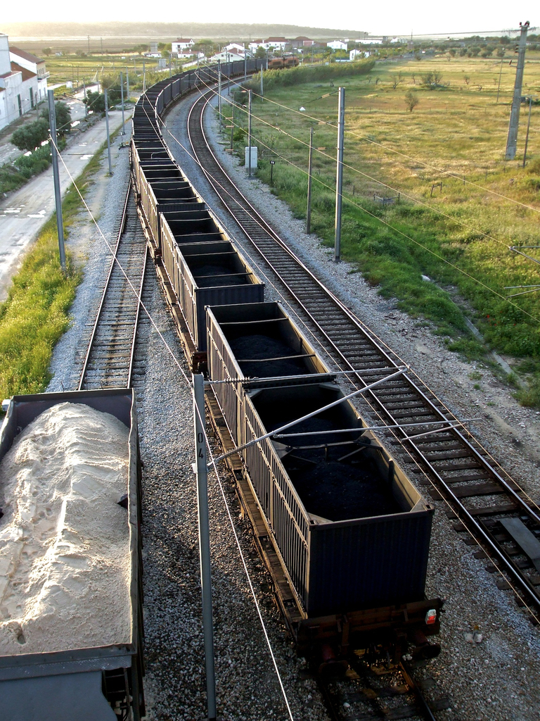 Real bulk petcoke wagons on a railway siding